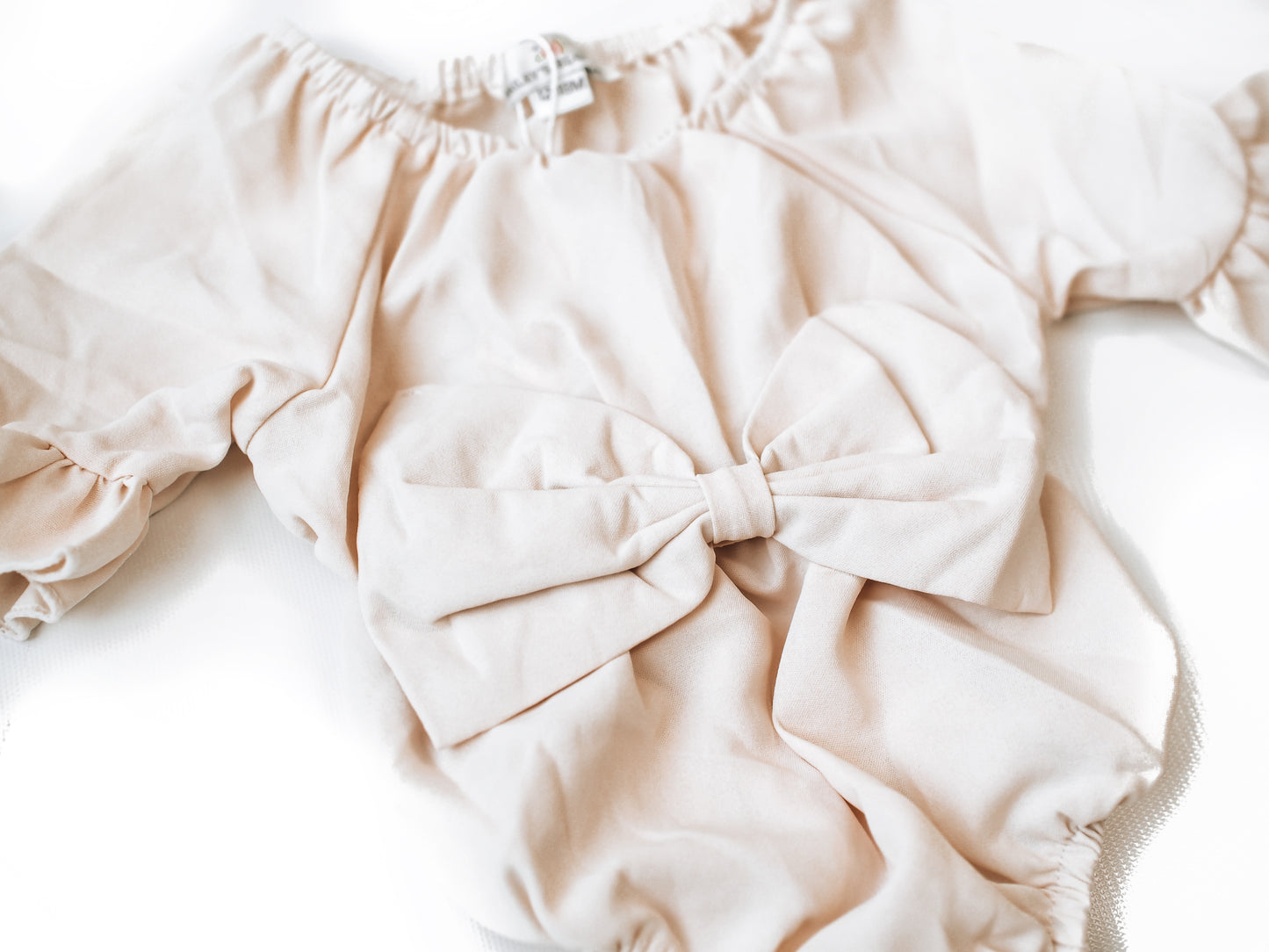 Ivory Bow Front Bubble Romper